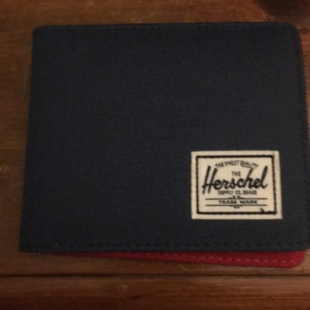 A Herschel blue with red wallet